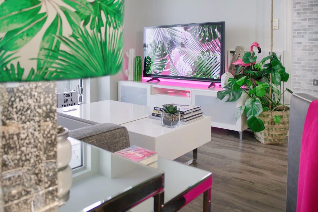 Pastel pink and neon living room decor evoking the 2016 millennial-pink color moment behind Benjamin Moore's reissued palette