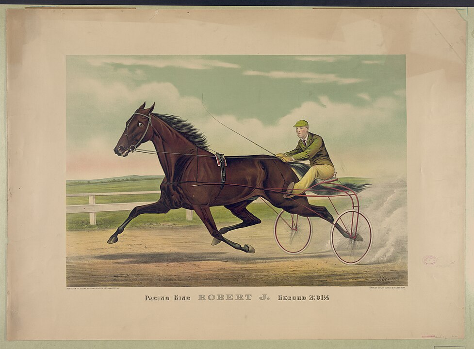 A harness racing horse trotting at full speed, pulling a sulky with a driver in yellow and green racing attire, set against a racetrack with a white fence and pastel sky in the background