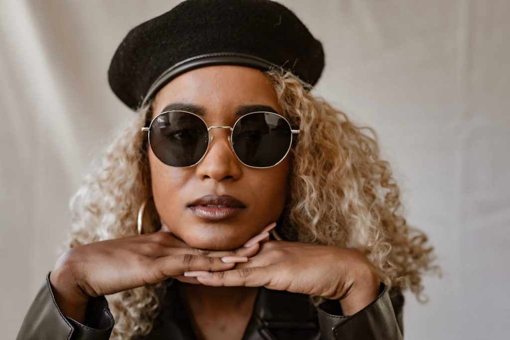 Portrait of a Woman with Black Sunglasses and a Black Beret