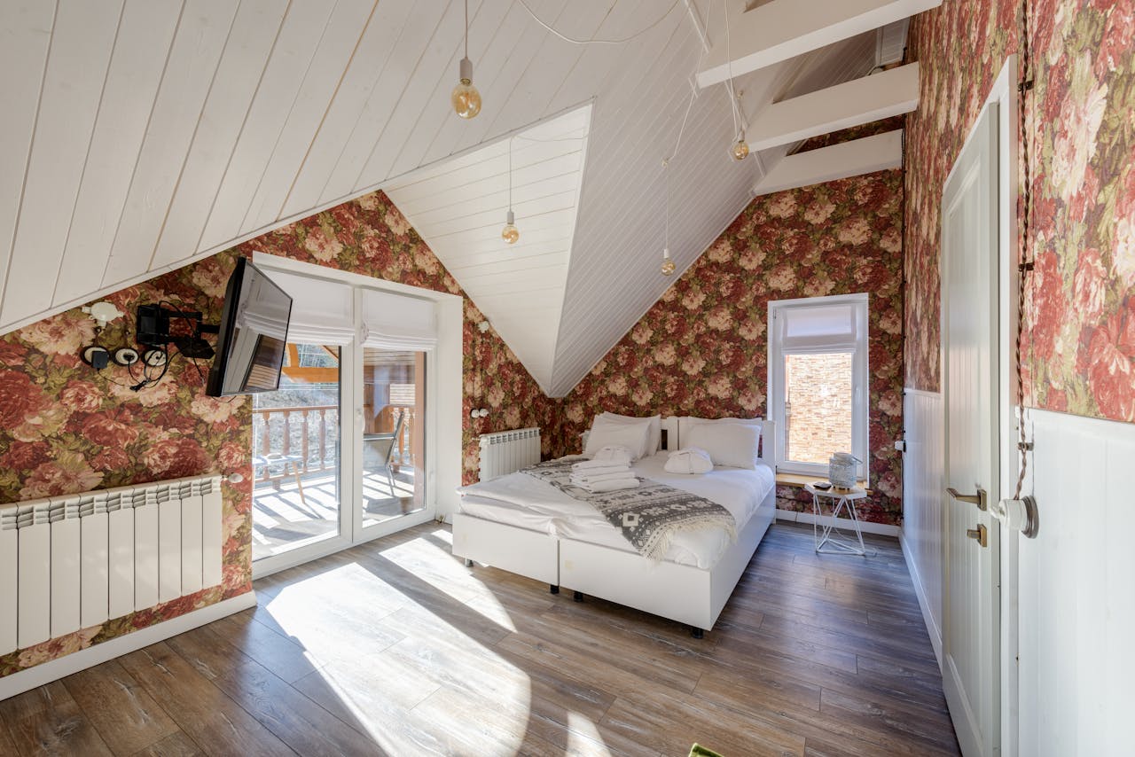A room with a large-scale, maximalist floral pattern covering the walls