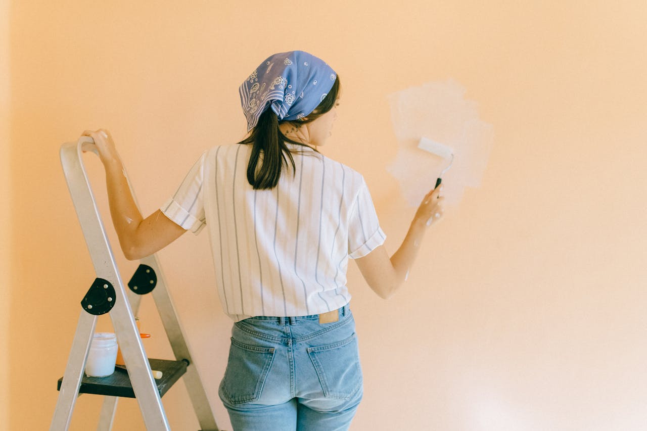 Woman Painting a Wall