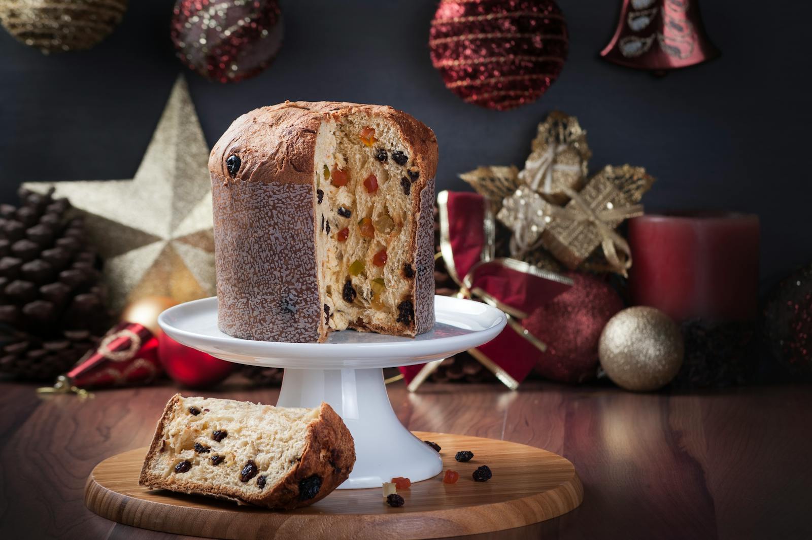 Delicious panettone served with festive Christmas decorations, perfect for holiday celebrations.