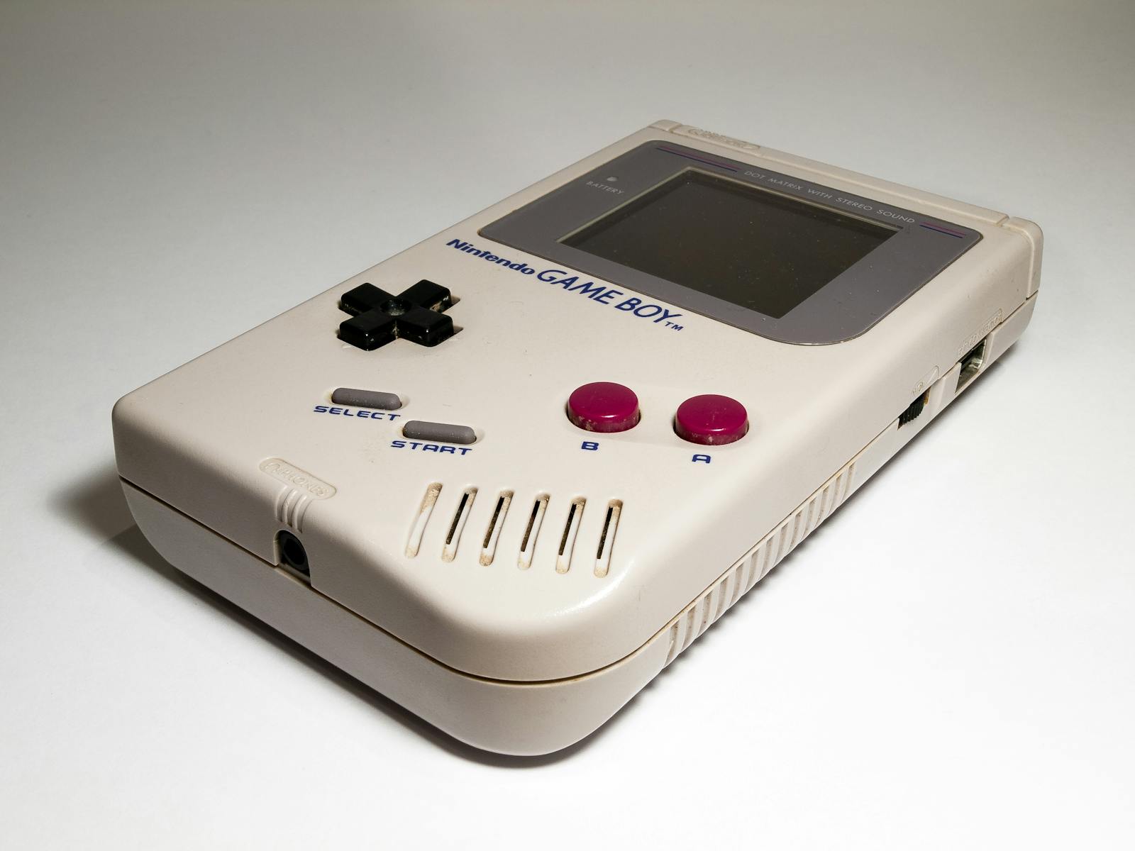 Close-up of a classic Nintendo Game Boy handheld console, iconic retro gaming device.