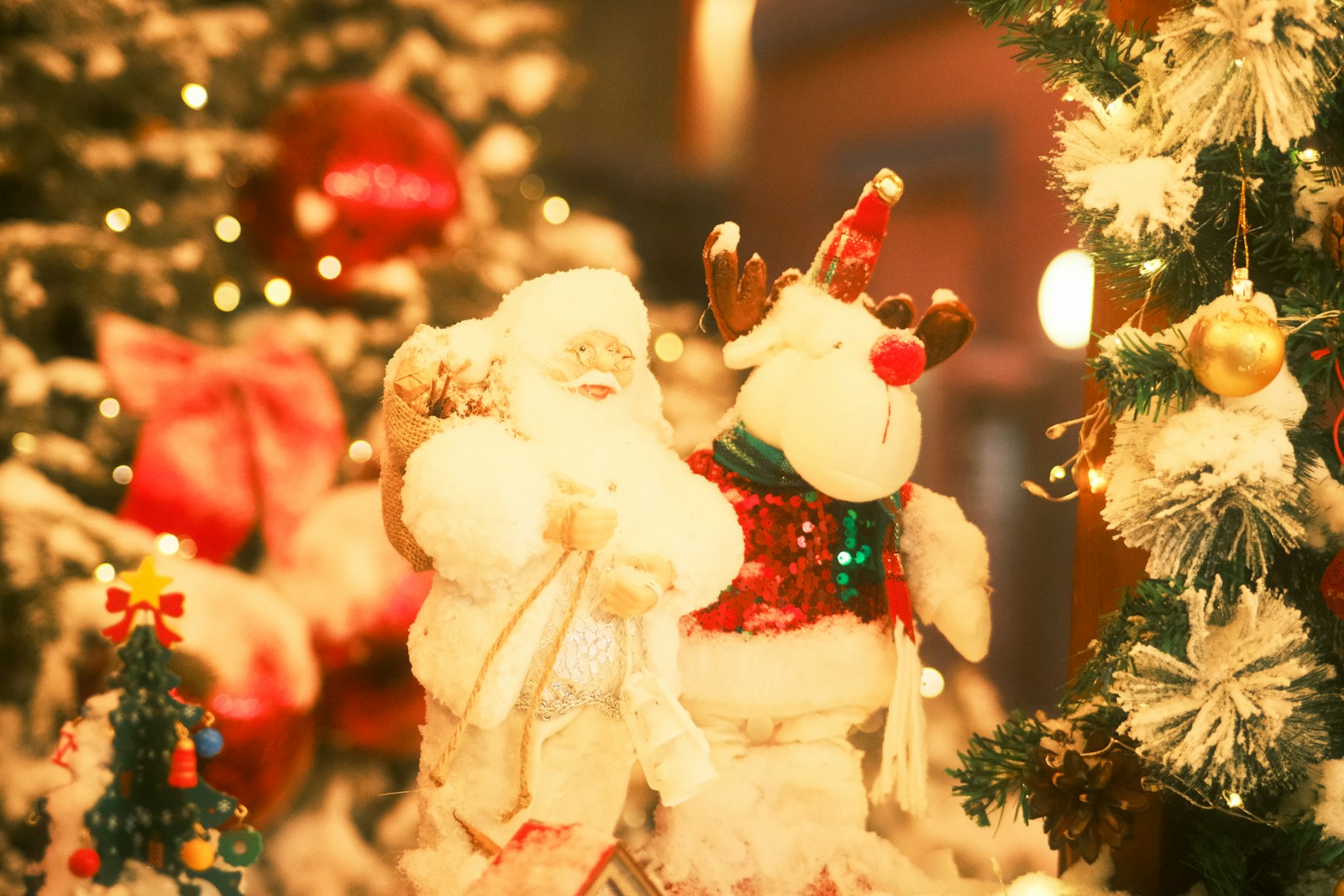A christmas display with a santa clause and other christmas decorations
