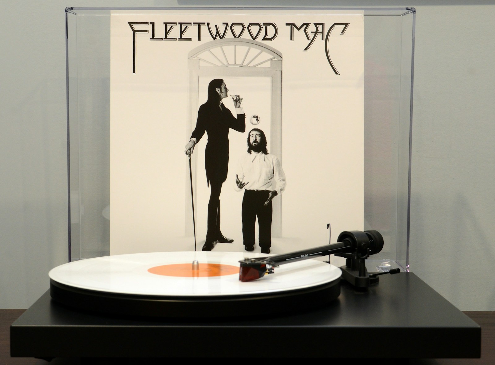 a man and a woman standing in front of a mirror