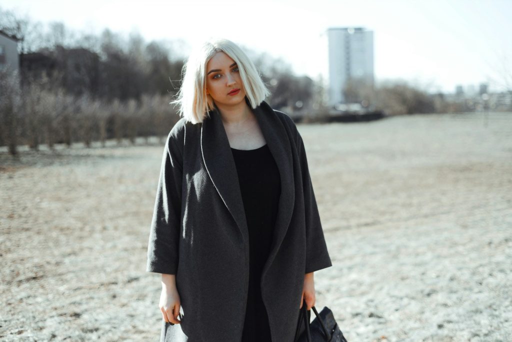 woman in black long sleeve dress