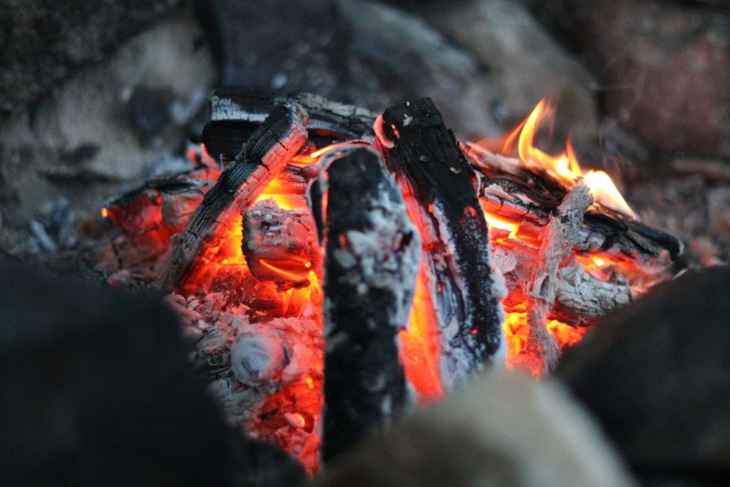 A close up of a fire burning in a fire pit