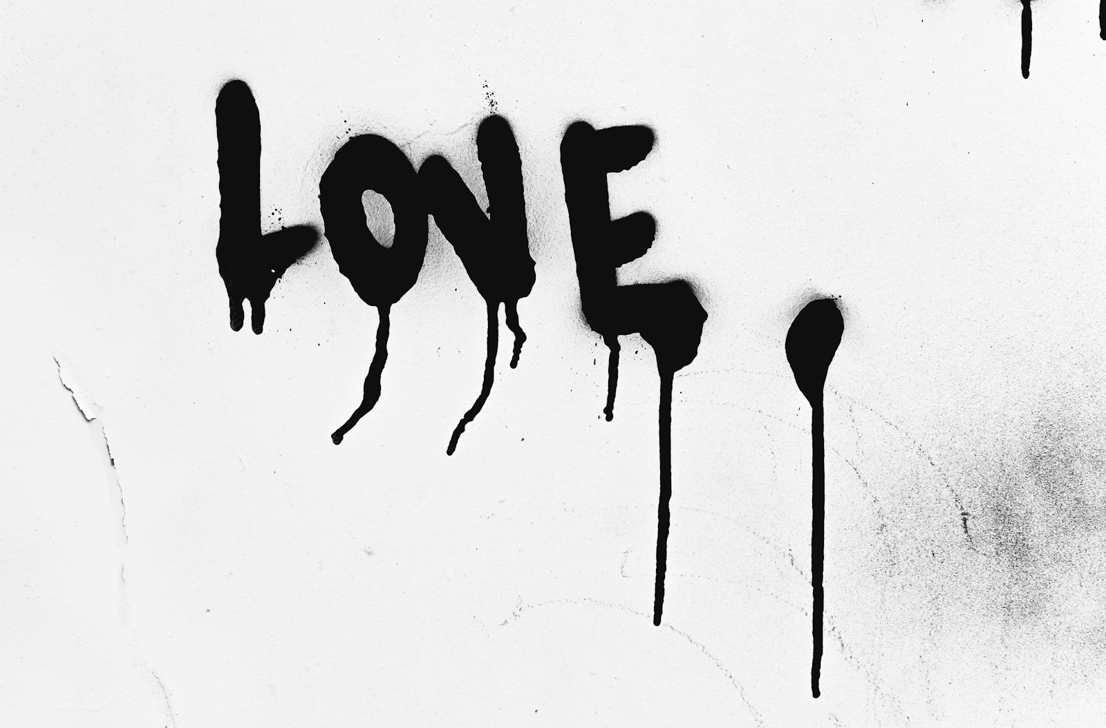 a black and white photo with the word love painted on it