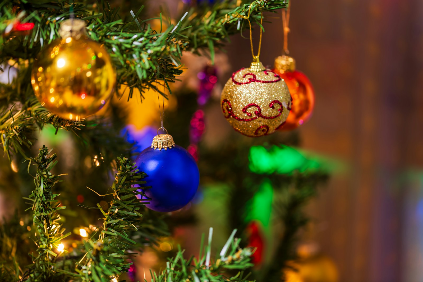 Close-up of decorated christmas tree ornaments
