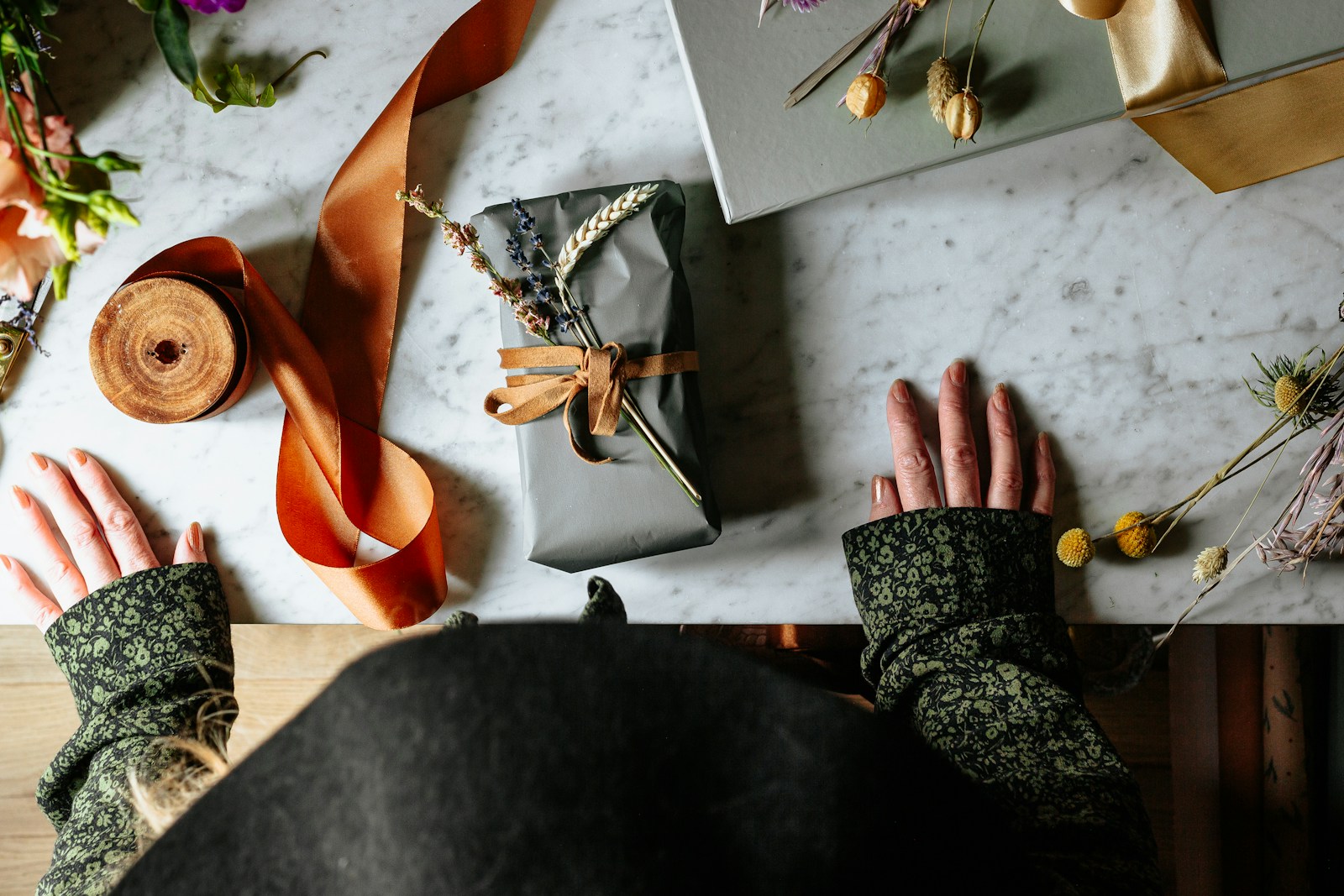 woman in black and white dress wearing brown leather sandals