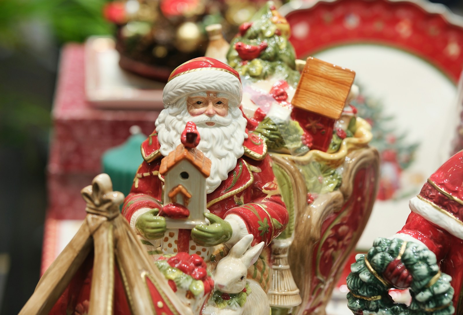 A santa clause figurine sitting on top of a table