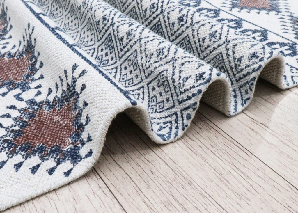 Close-up of a textured rug with geometric patterns