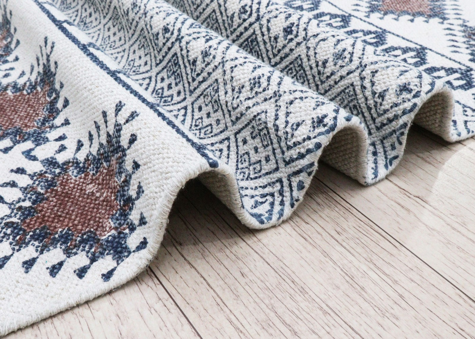 Close-up of a textured rug with geometric patterns