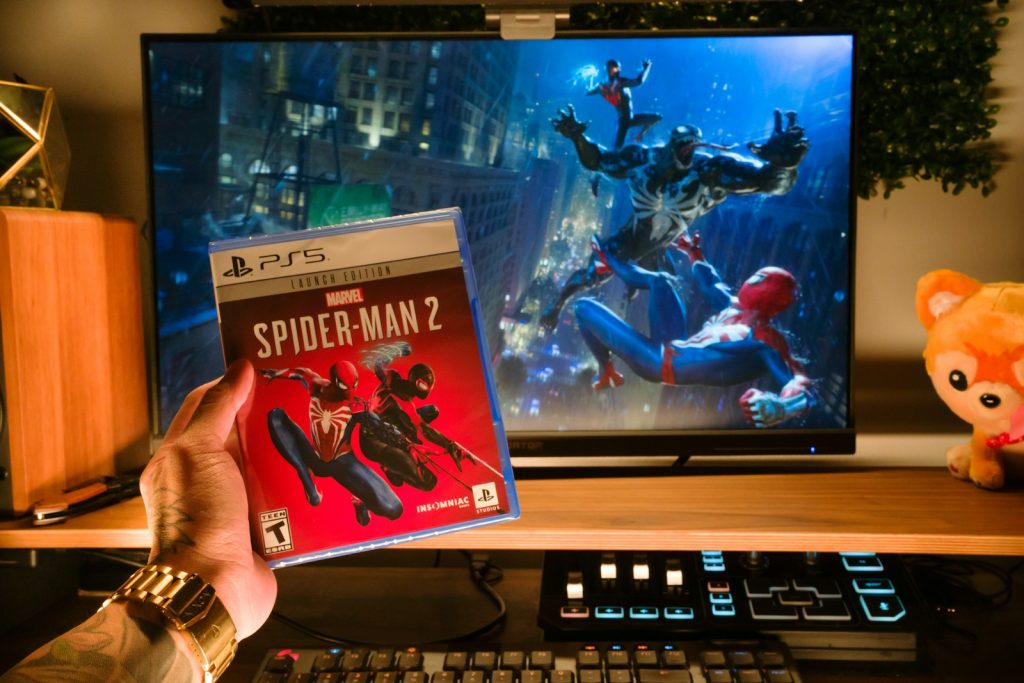 a person holding a video game in front of a television