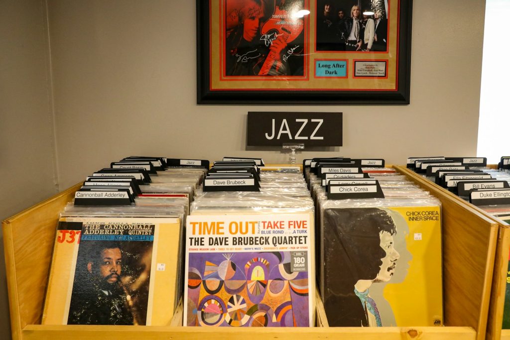 a collection of records on display in a music store