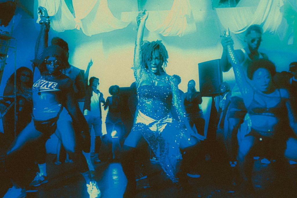 a group of people dancing in a room