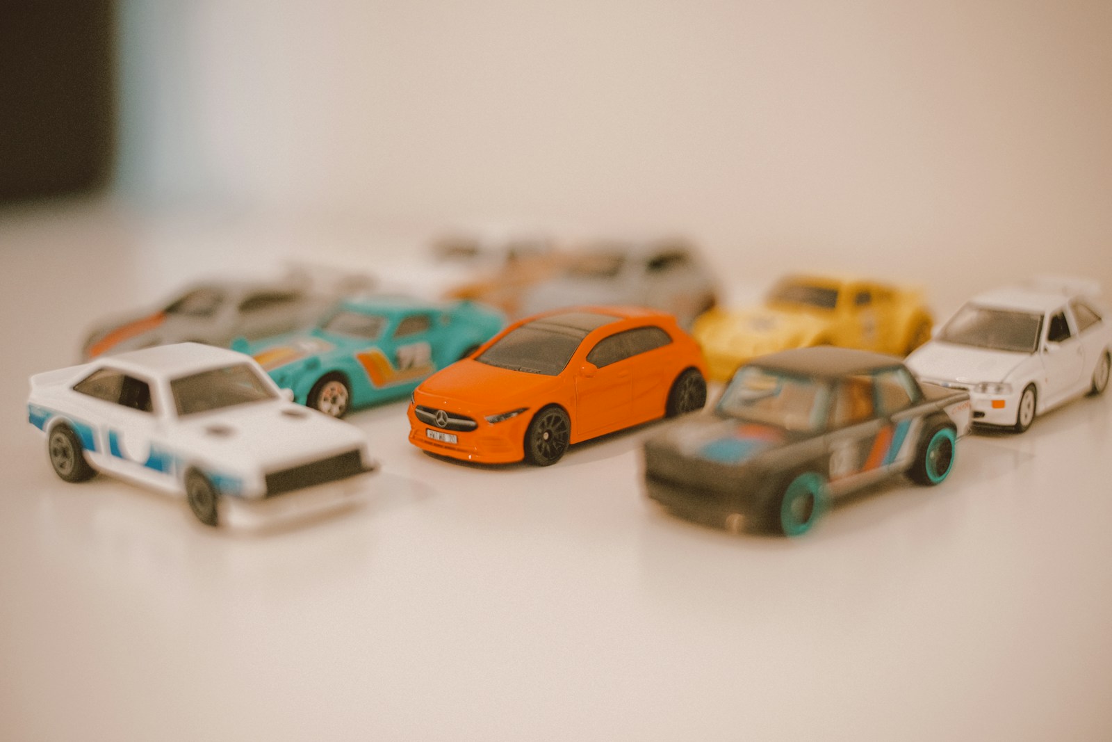 a group of toy cars sitting on top of a table