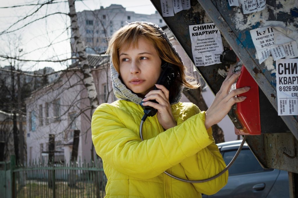 woman, call, phone booth, payphone, landline telephone, street, city, road, winter, communication