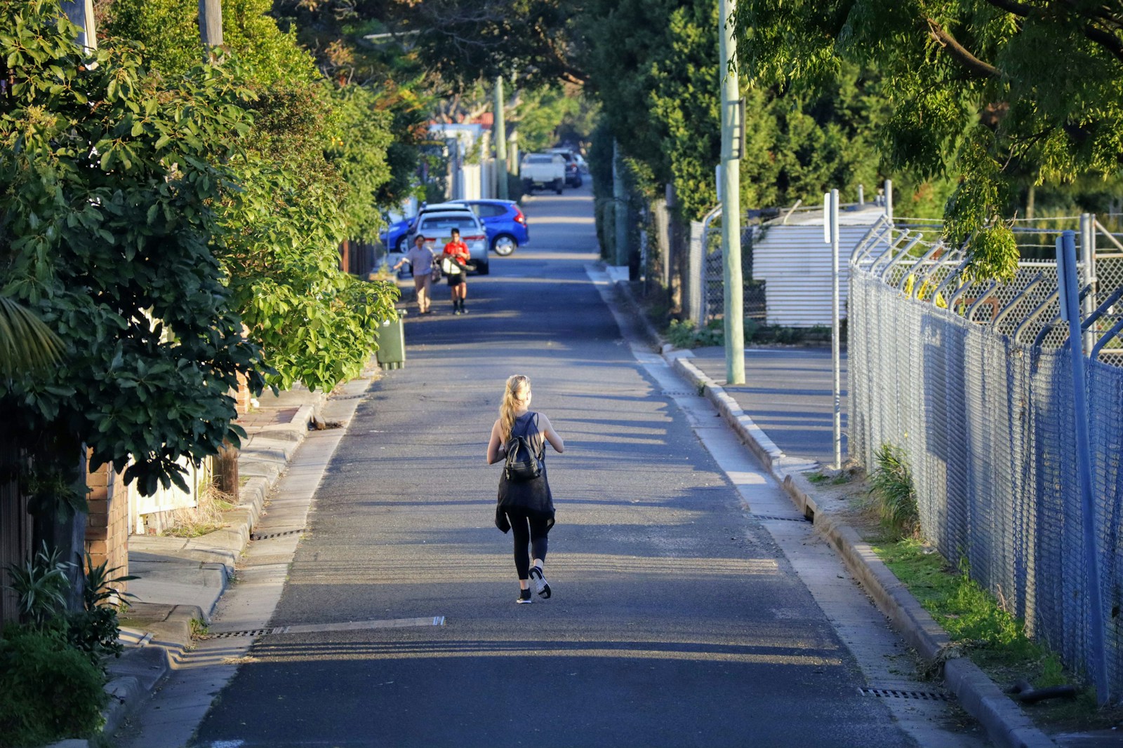 woman walking on street during daytime
