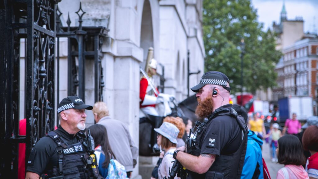 two police officers guard the gate