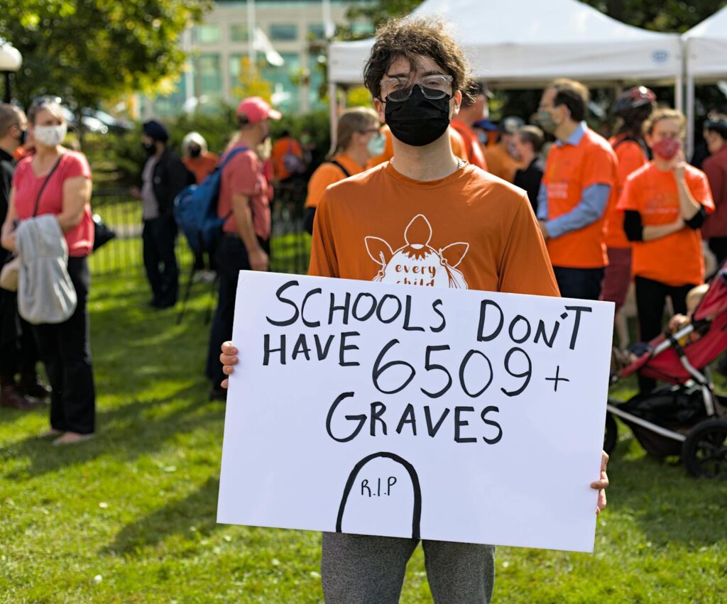 Protesters in Ottawa advocating for justice and equality with powerful signage.