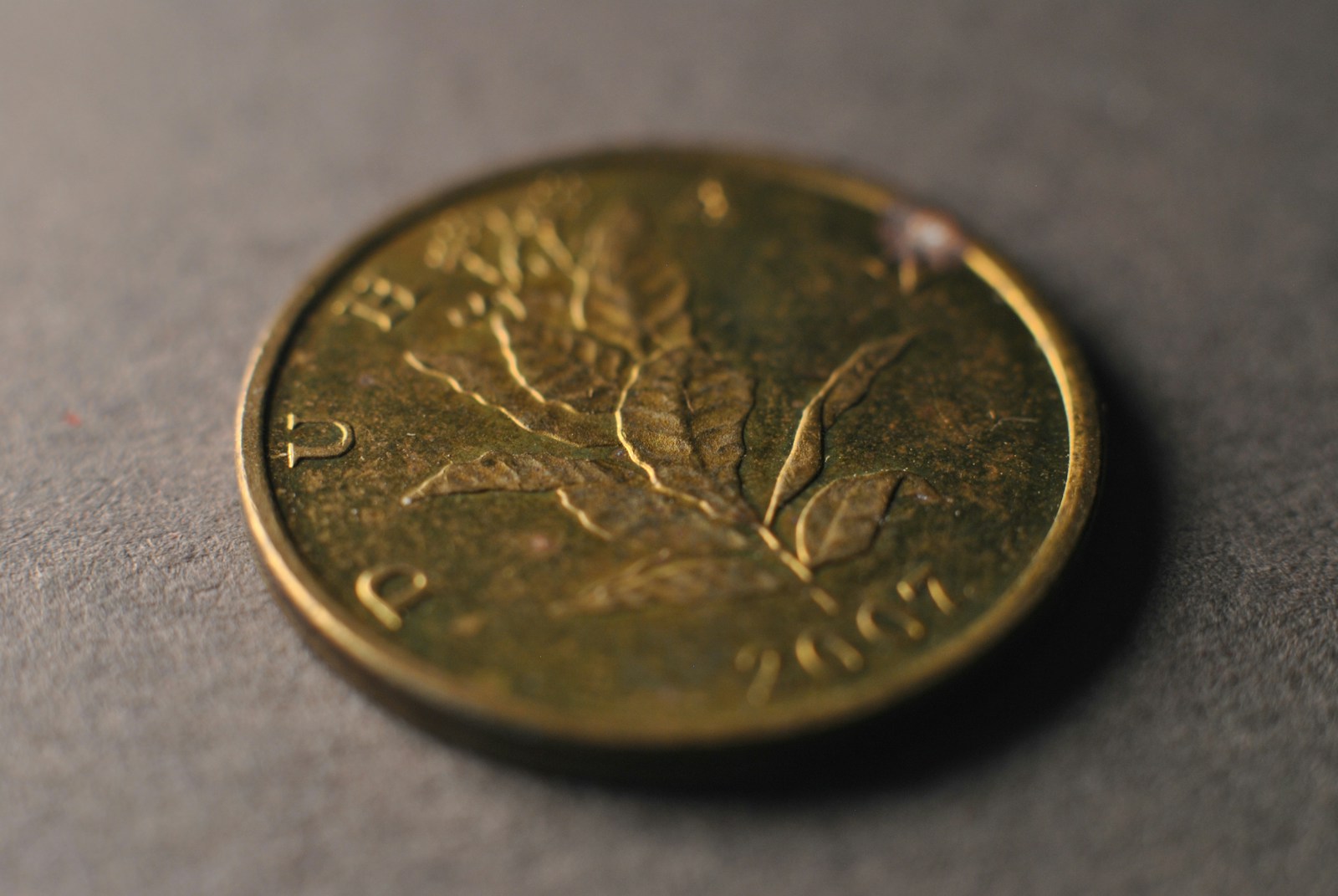 A close up of a coin on a table