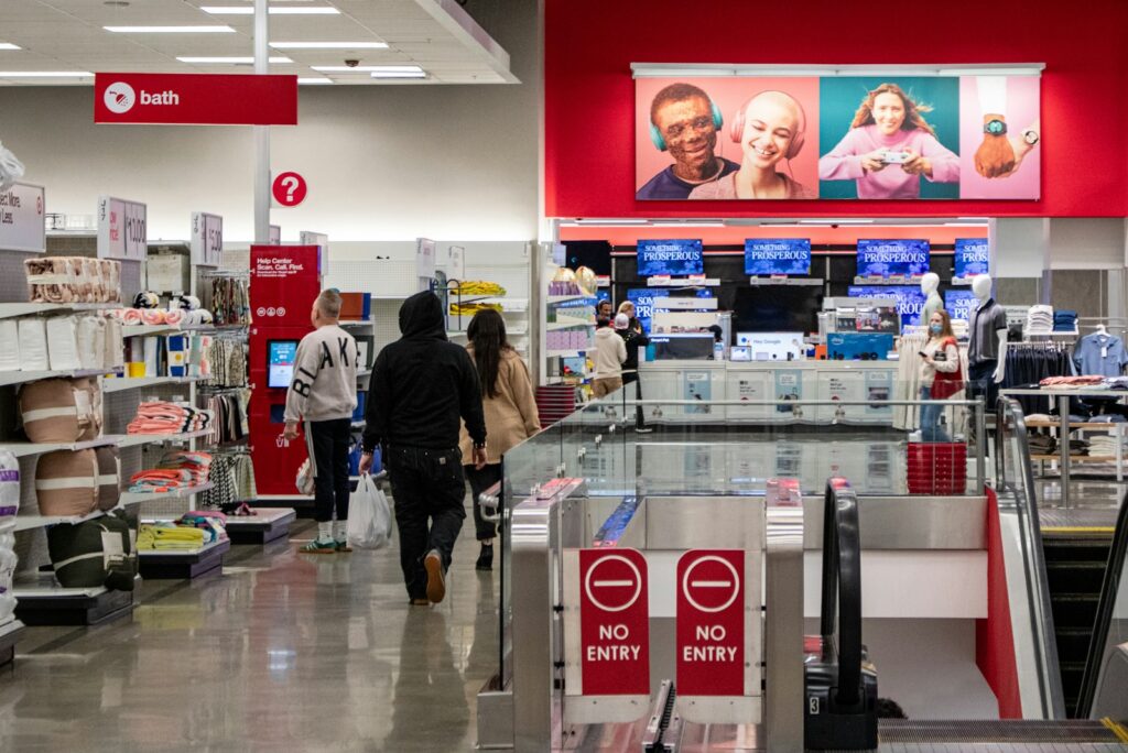 People shop in a target store aisle.