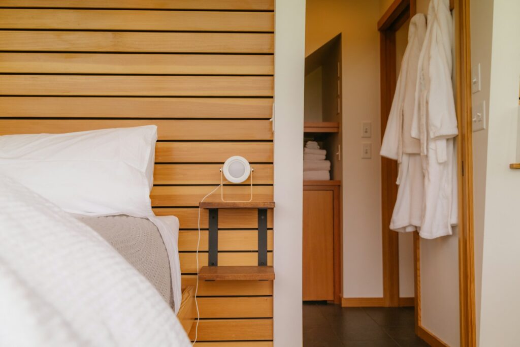 a bedroom with a bed and a mirror