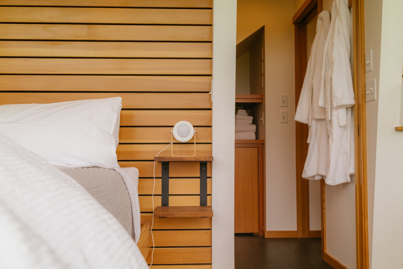 a bedroom with a bed and a mirror