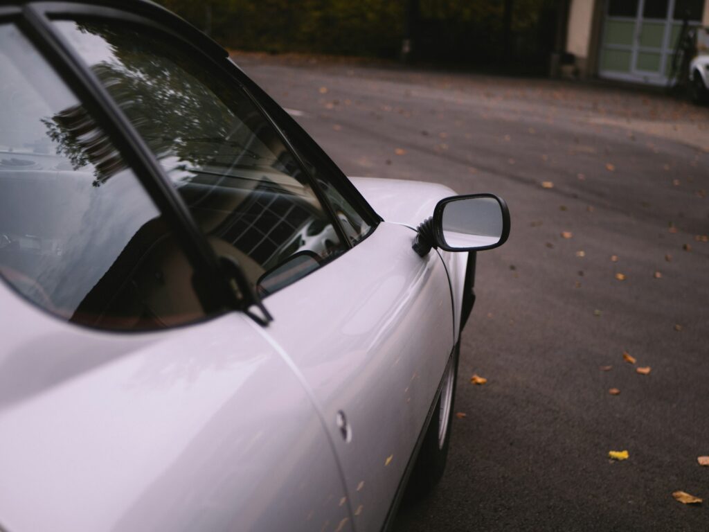 a white car parked on a street