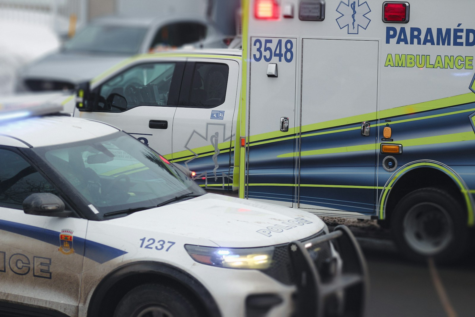 an ambulance is parked on the side of the road