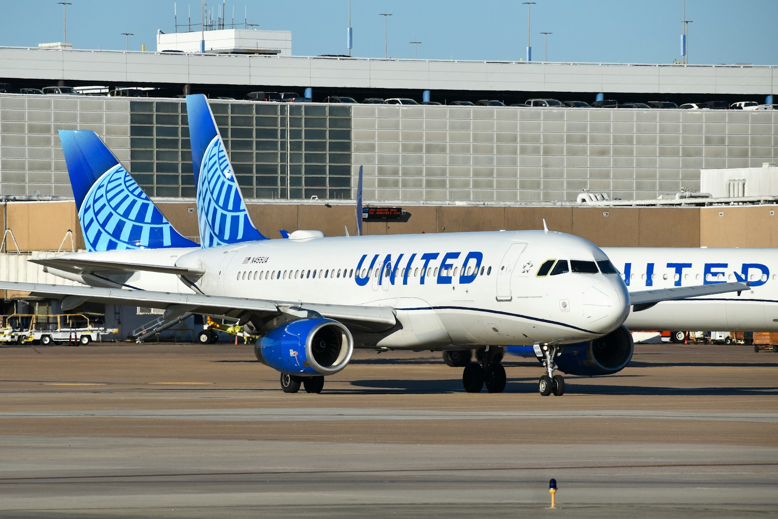 A large jetliner sitting on top of an airport tarmac