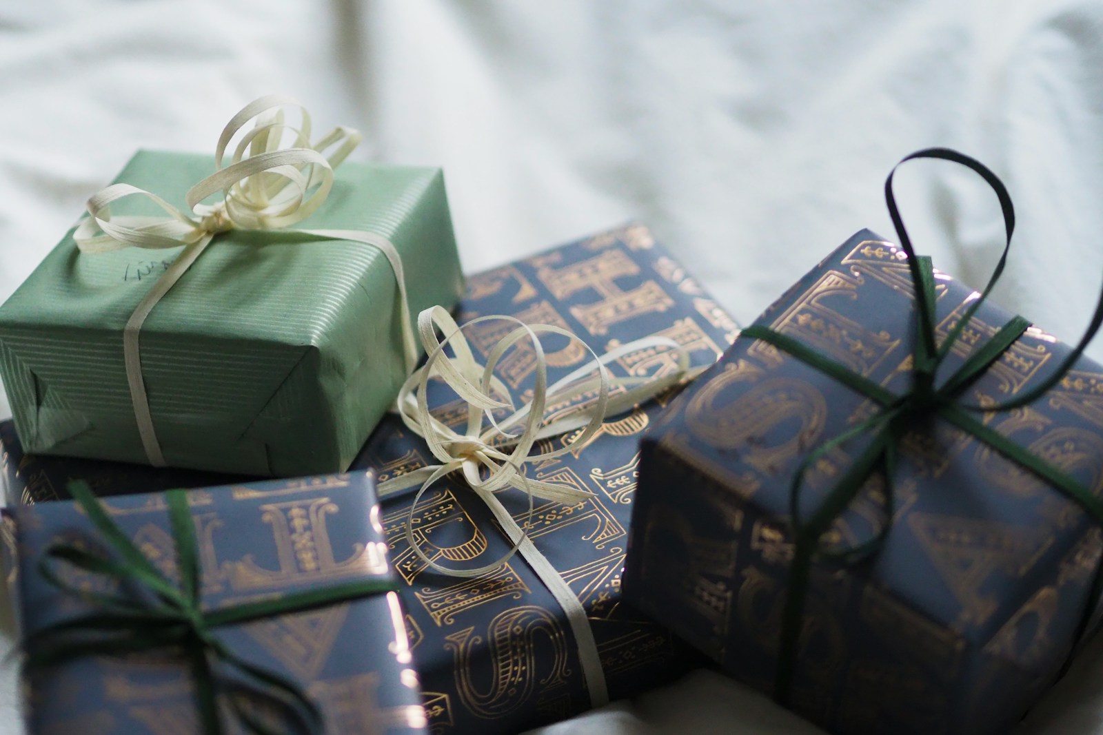 A group of wrapped presents sitting on top of each other