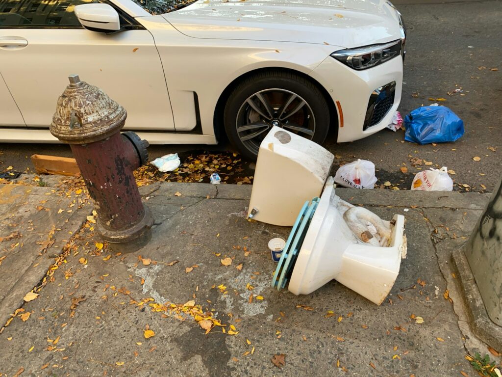 toilet bowl besid eparked vehicle