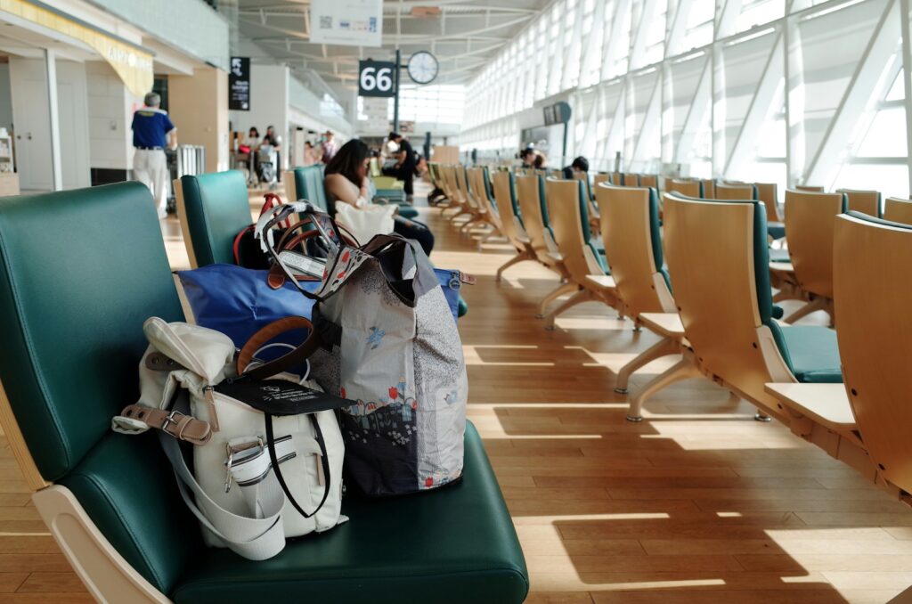 a bunch of bags sitting on a bench in an airport