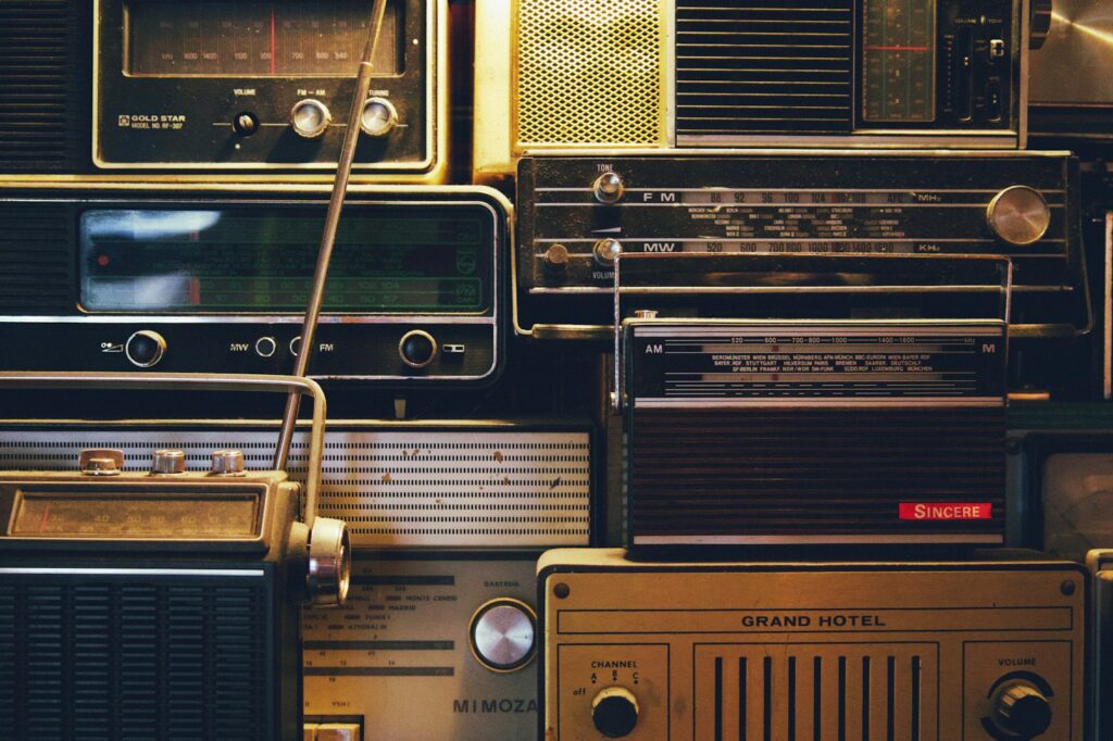 a bunch of old radio's are stacked on top of each other