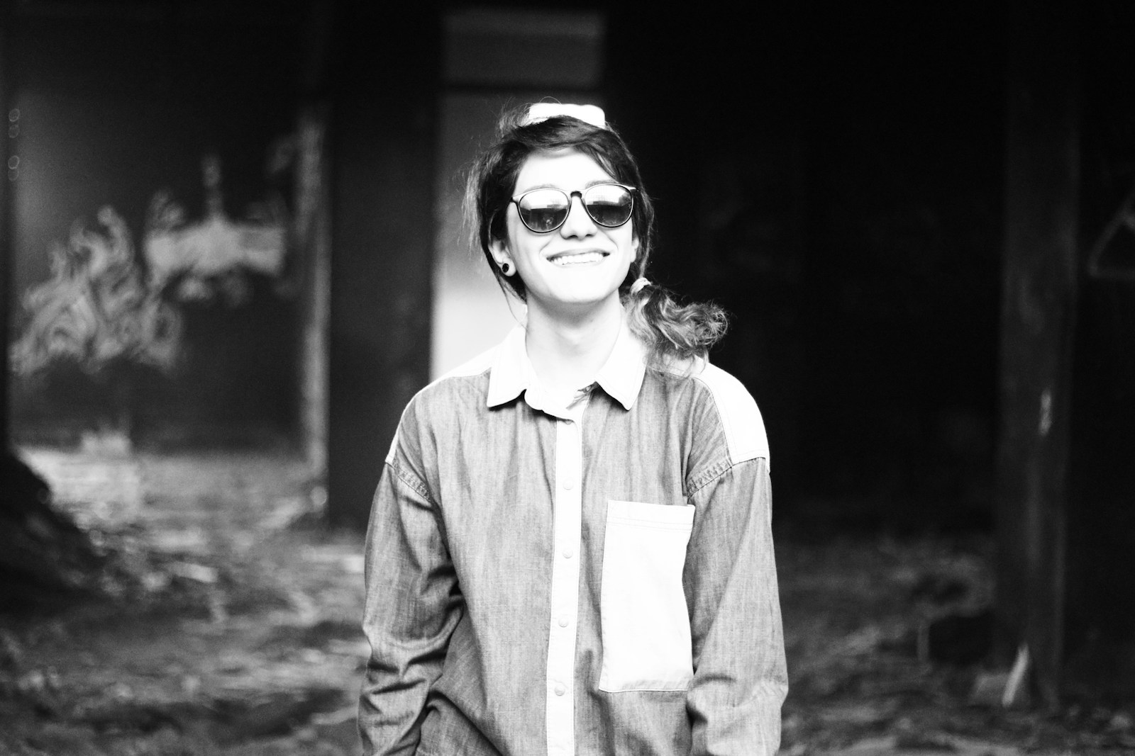 grayscale photo of woman in button up shirt and sunglasses