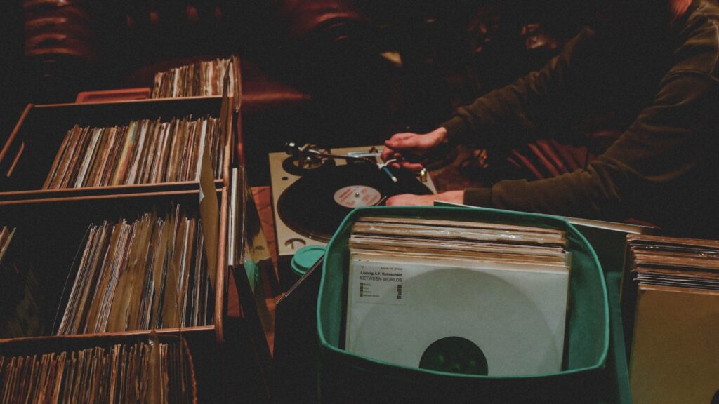 a record player and a record player in a room full of records