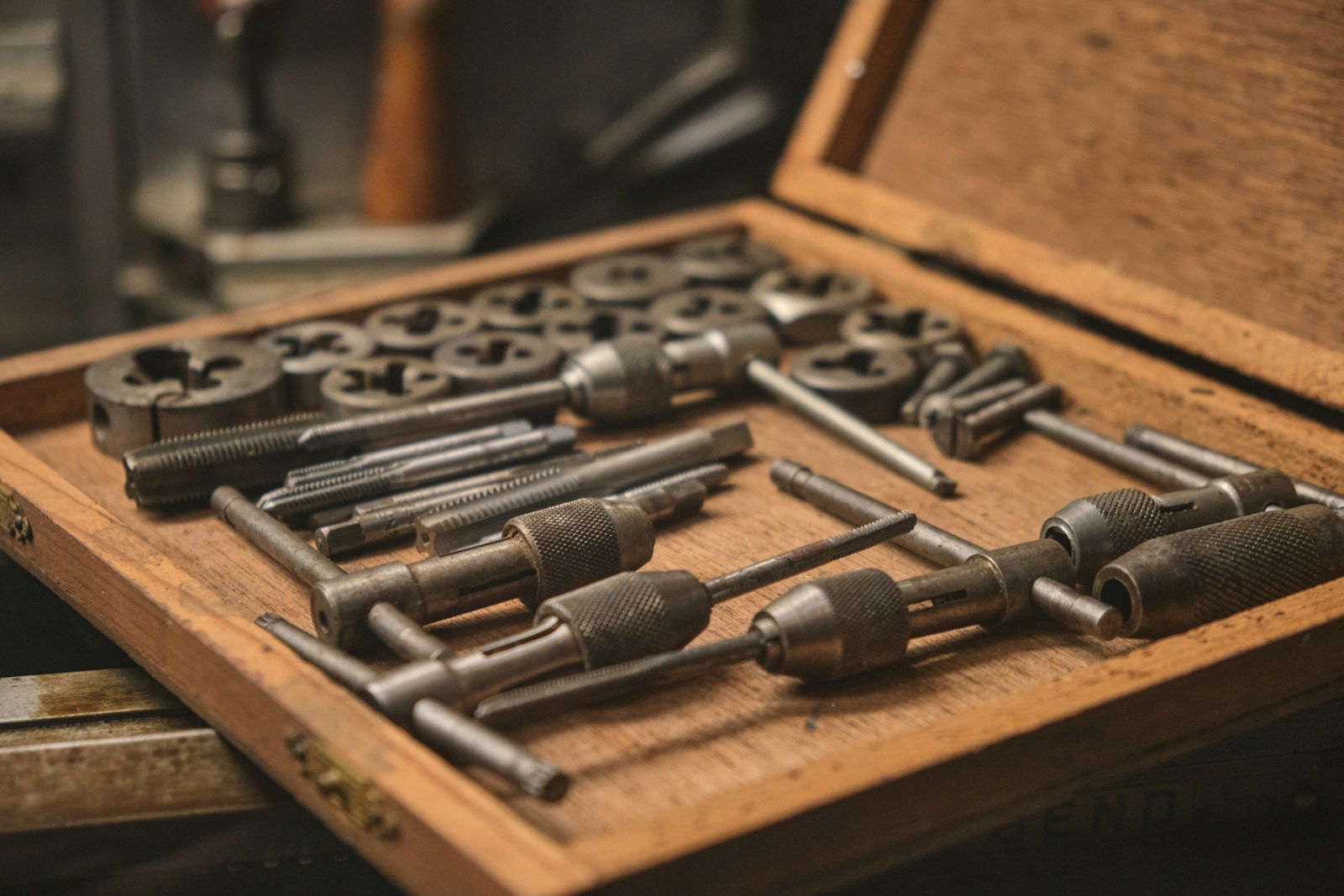 selective focus photography of gray socket wrench set with brown box