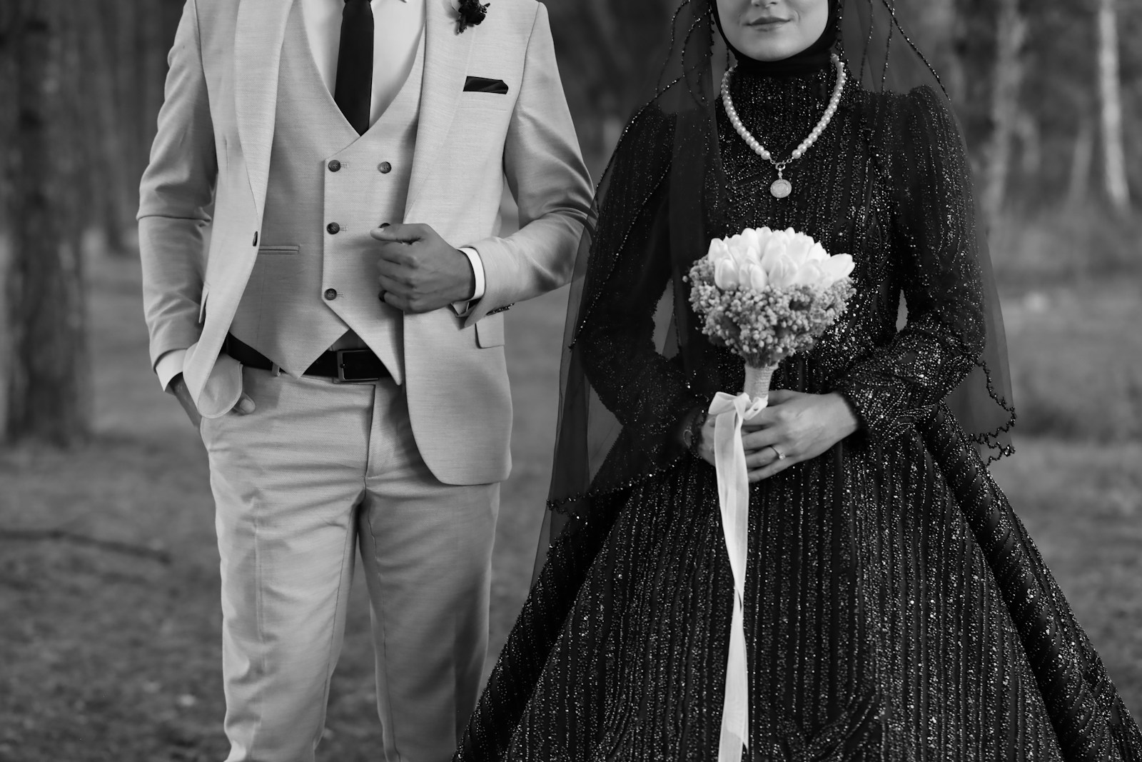 A man and a woman dressed in formal wear