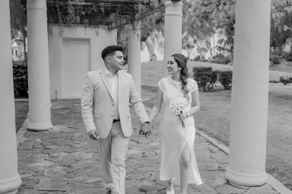 a man and a woman are holding hands