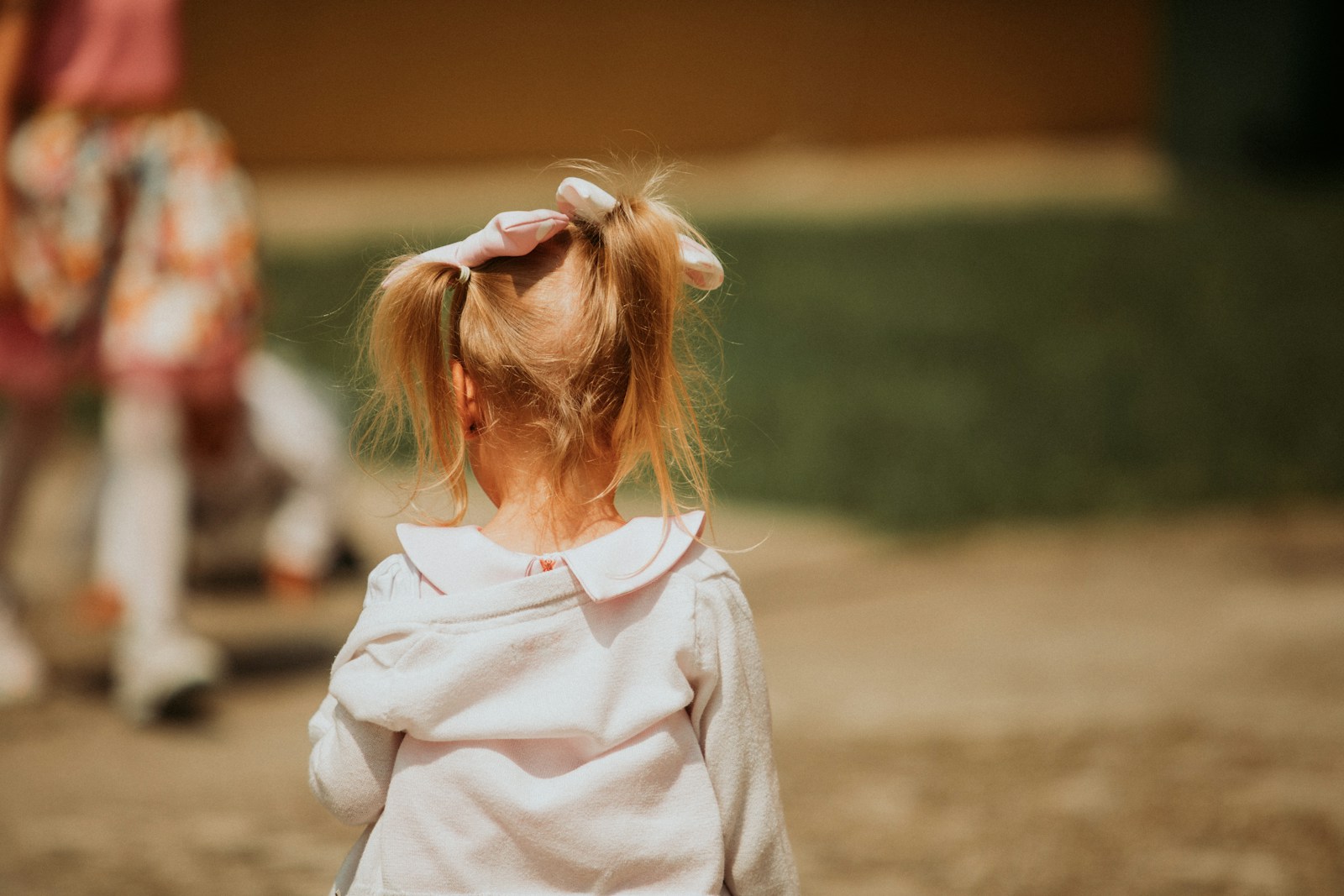 a little girl with a bow in her hair