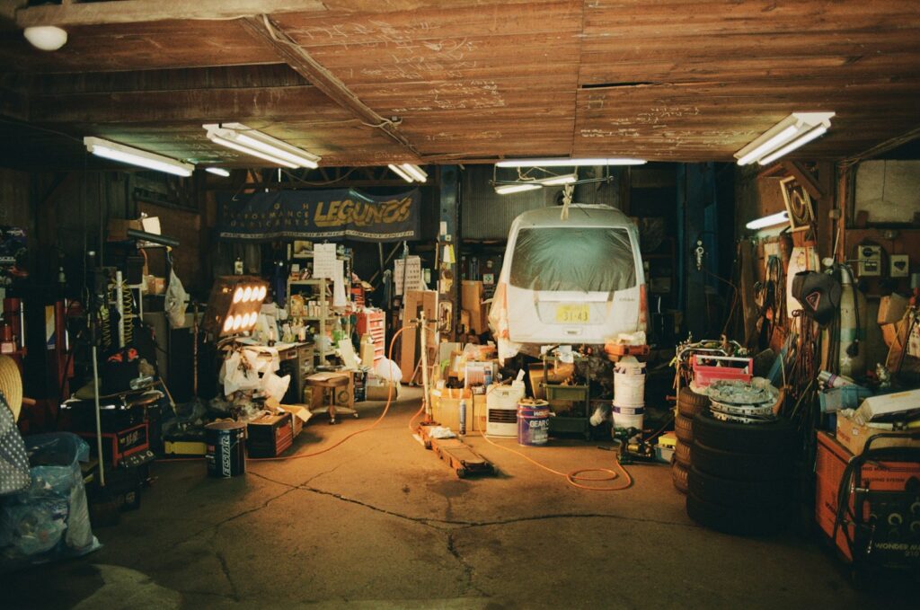 The garage is messy but full of tools.