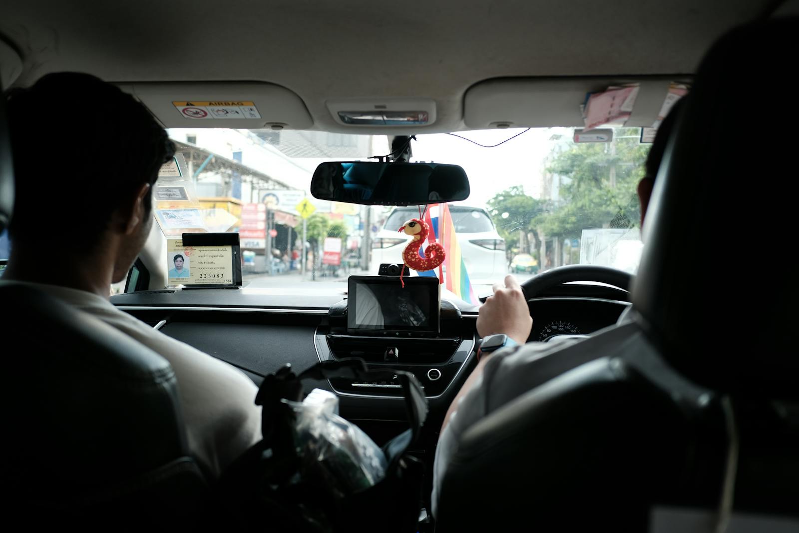 Experience a typical taxi ride through the streets of Bangkok, Thailand.