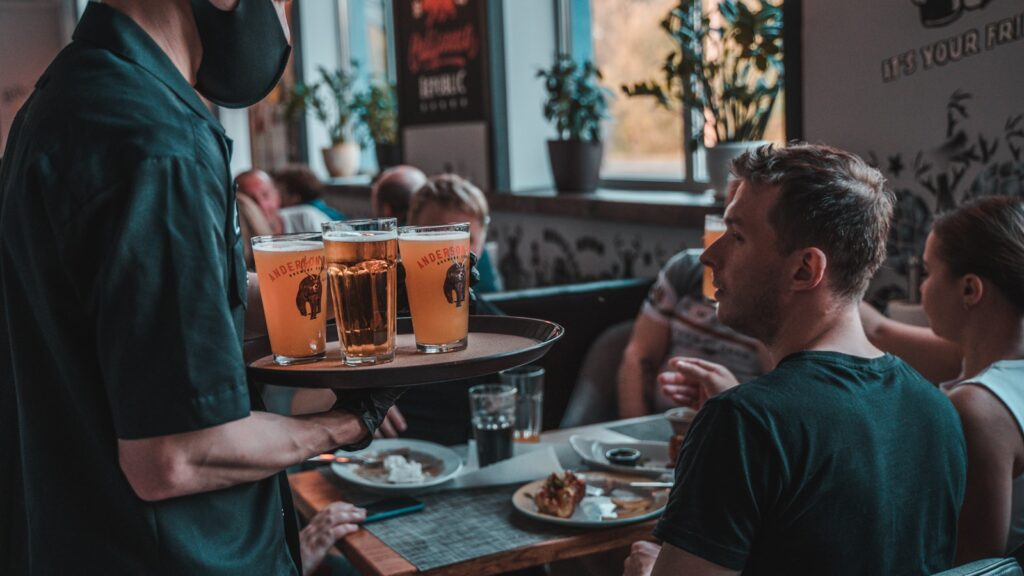 man in black crew neck t-shirt sitting beside man in black crew neck t-shirt