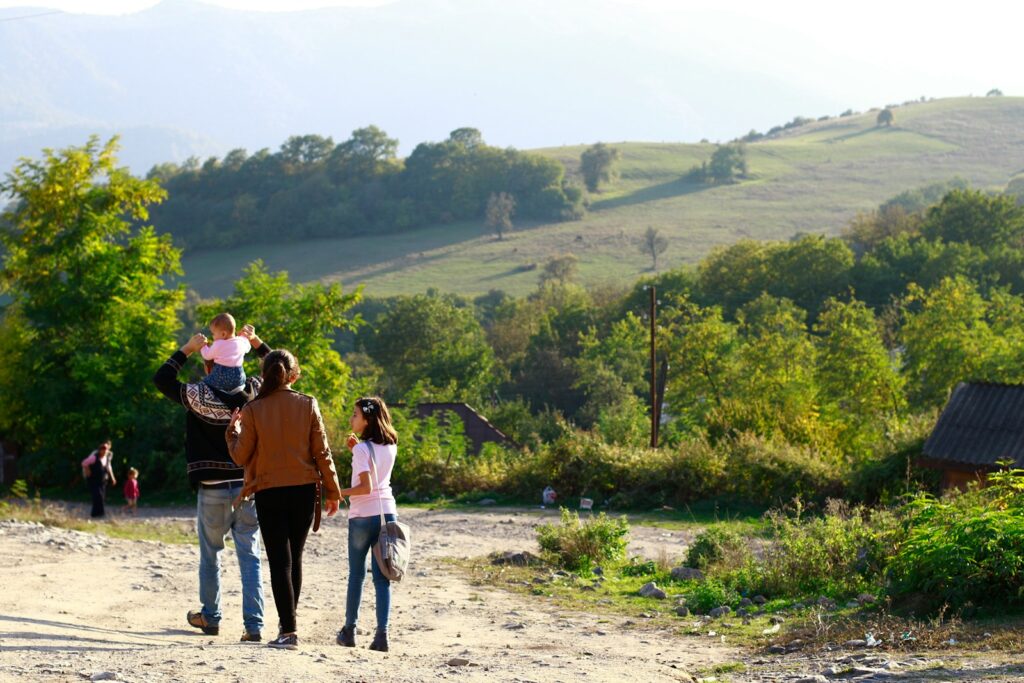 people walking on dirt road during daytime