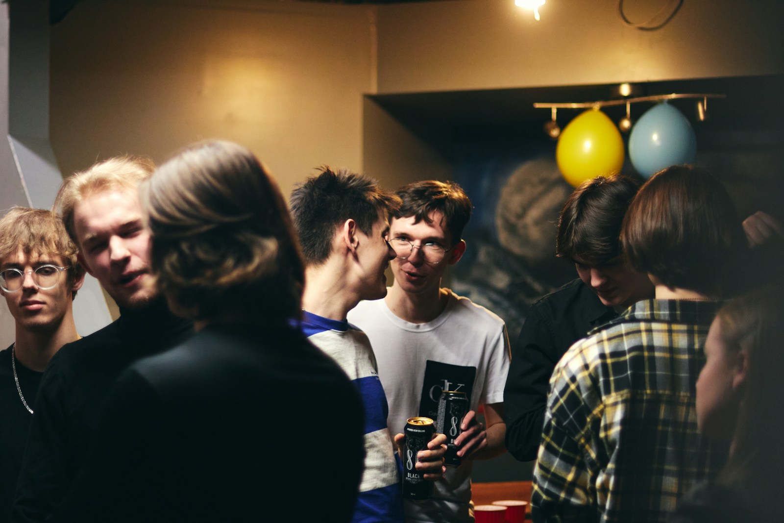 A group of people standing around each other