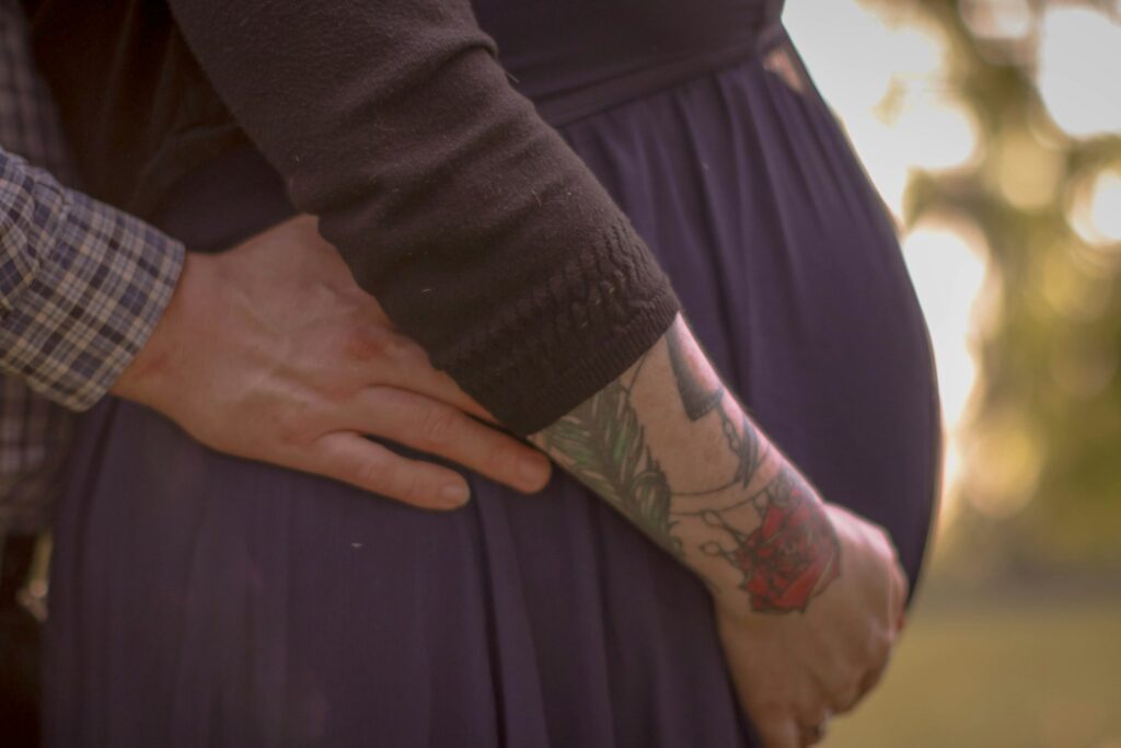 woman in black long sleeve shirt and blue skirt