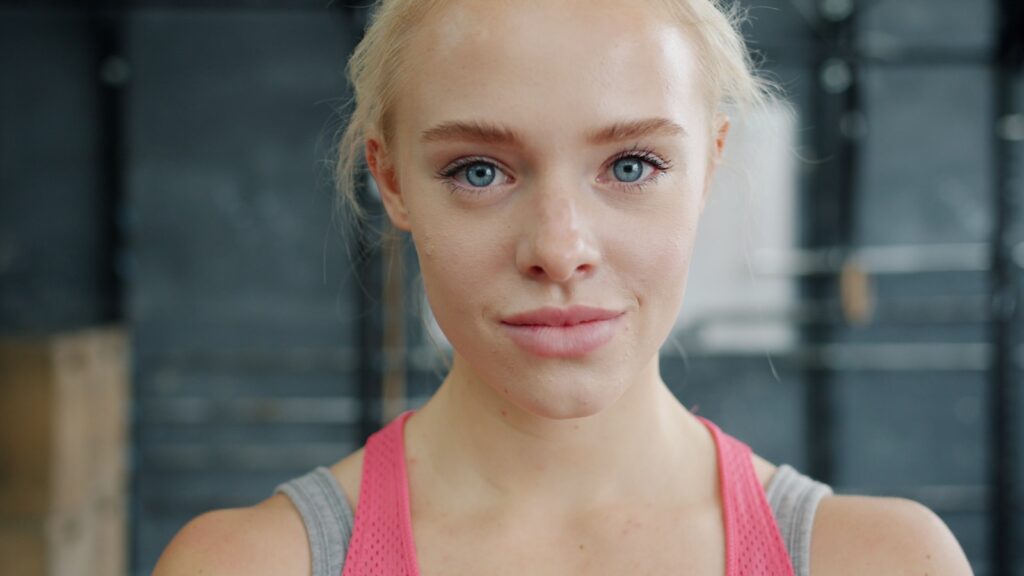 Young woman with blonde hair in gym