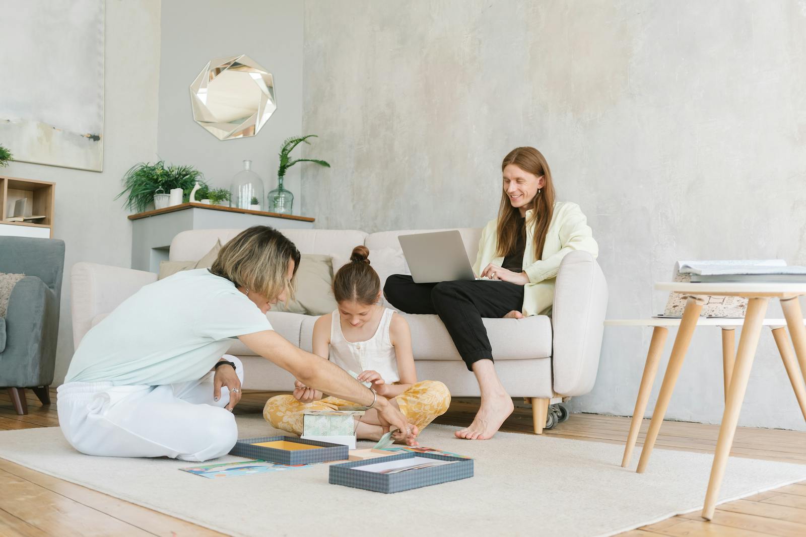 A family enjoys quality time in a cozy living room, engaged in creative bonding activities.